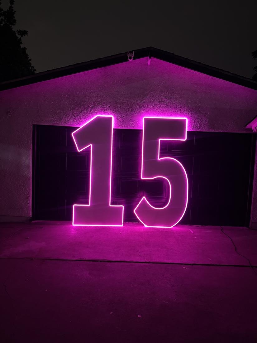 Marquee number 15 outlined in pink LED